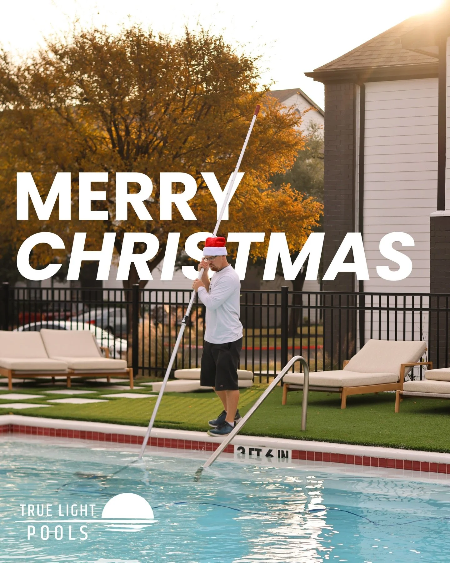 A True Light Pools technician in a Santa hat